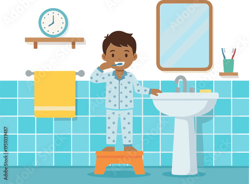 A young boy in pajamas brushes his teeth standing on a stool in a bathroom.