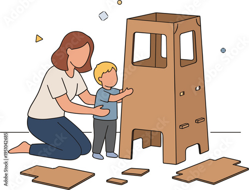 A woman and a boy are building a cardboard house together indoors.