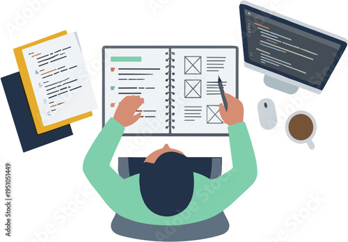 A person studies and works on documents at a desk with a computer