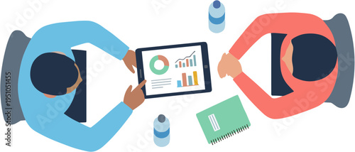Two people sitting at a table looking at a tablet with graphs on it