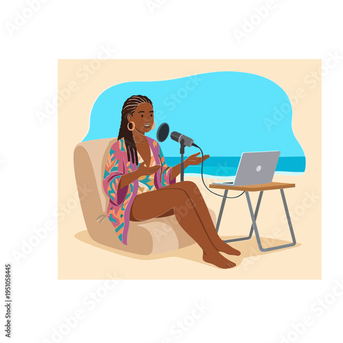 A woman sits on a couch recording a podcast on her laptop by the ocean.