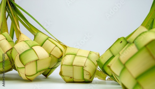 Beautifully woven traditional ketupat on white background
