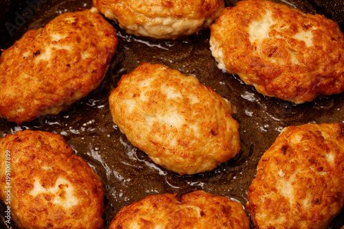 Картината върху платно Minced meat cutlets are fried in oil in a frying pan