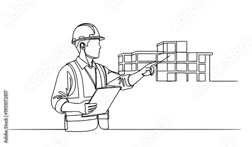 A construction worker in a hard hat pointing at a building design