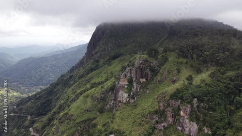Ella Rock covered in clouds Sri Lanka, aerial drone view of misty mountains and lush green tropical highlands
