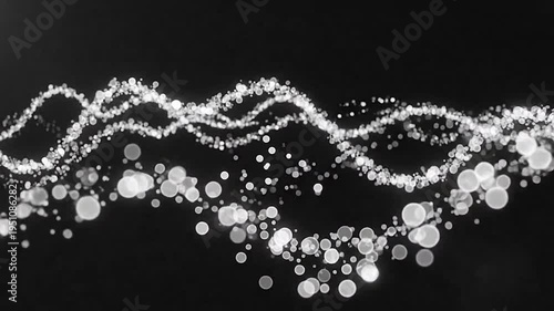 Abstract glowing particles forming a wavy line on a dark background
