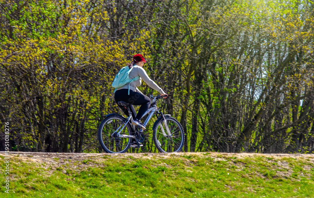 Fototapeta premium Cyclist ride on the bike path in the city Park 