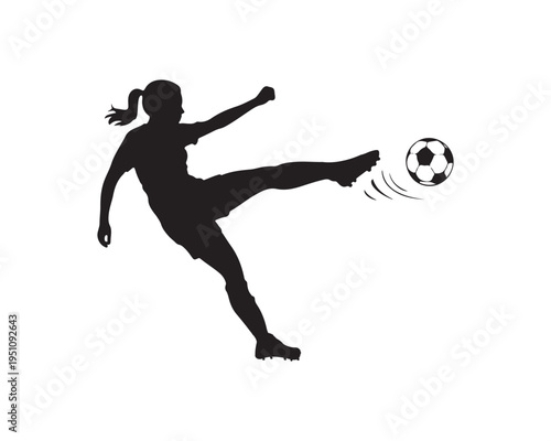 Silhouette of a female soccer player in action kicking a soccer ball with force and determination during a game or practice