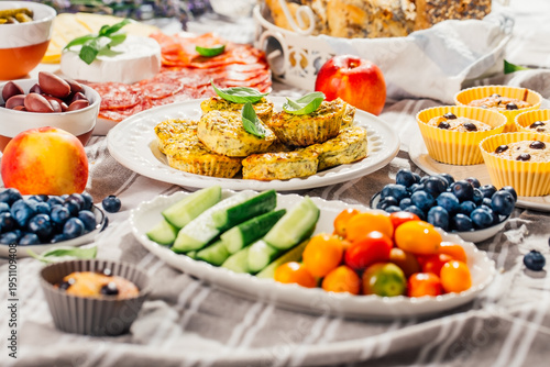 Easter brunch with fresh vegetables, muffins, snacks and appetizers