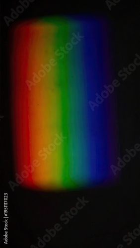 A blurry, rectangular spectrum with vibrant, blended colors on black