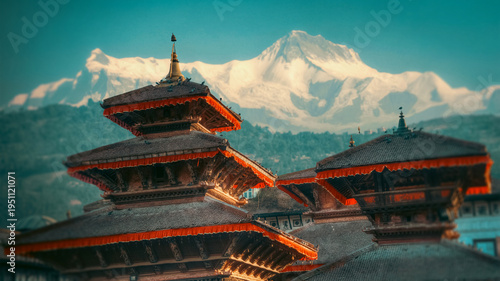 : Ancient Nepal Pagodas with Snowy Himalayan Peak Background with copy space