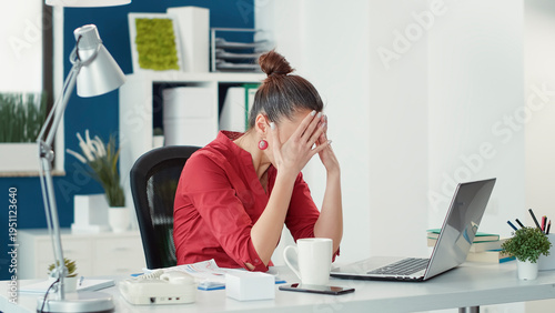 Slika na platnu Stressed employee making mistake at office startup job, using sales statistics to do data research
