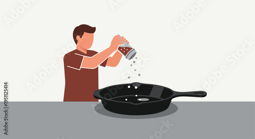 Person seasoning food in a pan with a shaker