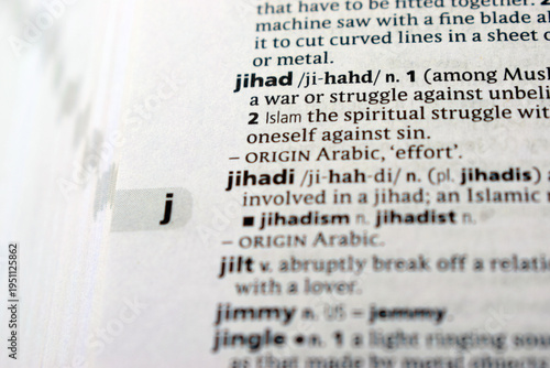 Close Up English Dictionary Page With The Word Translation Of - jihad