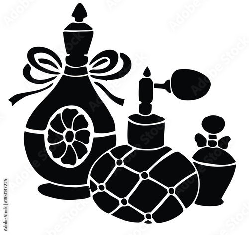 Black and white of a collection of vintage perfume bottles and accessories atomizer vial dropper