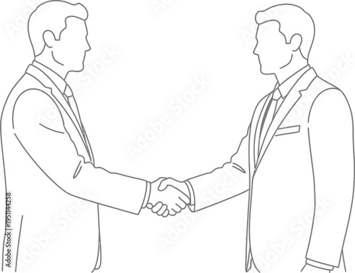 Two businessmen in formal suits firmly grasp hands across the frame executing a successful partnership or agreement.