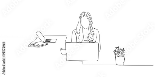 A female office worker is working in front of a laptop