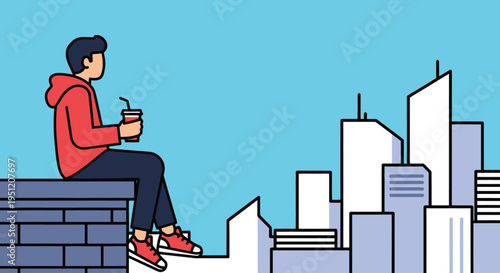 Young man sitting on wall ledge.