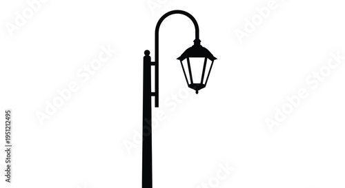 A solitary black silhouette of a classic street lamp on white