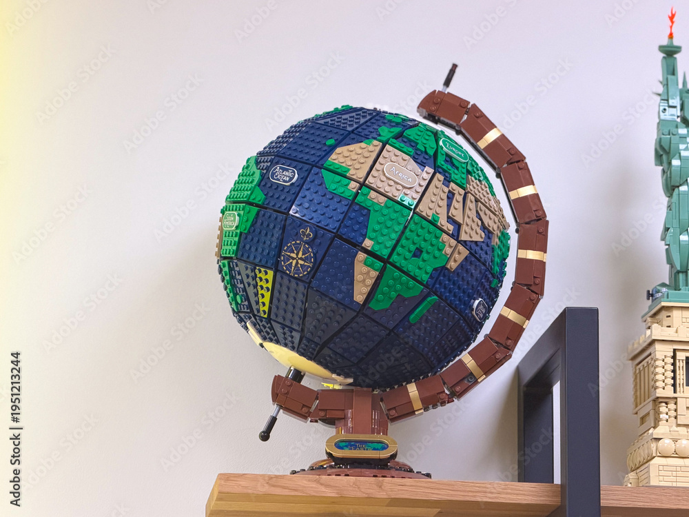 Fototapeta premium Lego globe model on wooden shelf