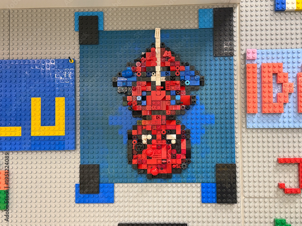 Fototapeta premium Lego pixel art red spaceship on blue baseplate