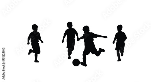 Four children playing with a ball in a dark silhouette