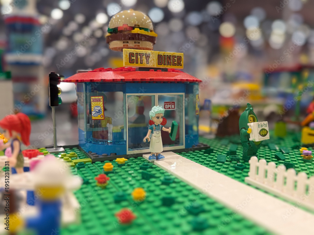 Fototapeta premium Lego city diner with burger sign and minifigure outside
