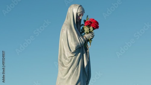 Statue of the Virgin Mary with a bluesky