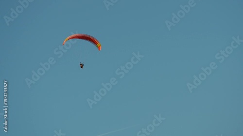 paragliding in the blue sky