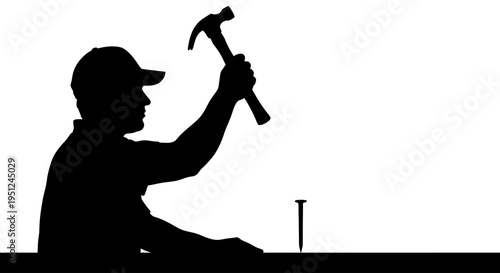 Man in silhouette holding hammer.