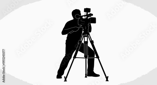 Man operating a video camera.