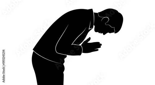 Man bowing head in prayer gesture.