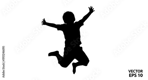 Silhouette of a jumping young boy.