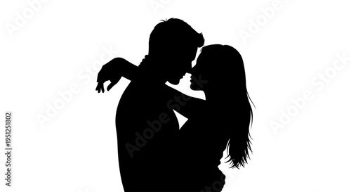 Silhouette of romantic couple embracing closely.