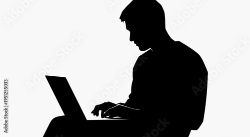 Man working on laptop computer.