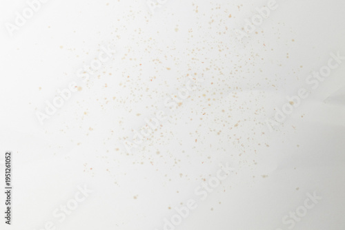 Photos top-down view showing fine crumbs and spice residues left behind by the spicy an