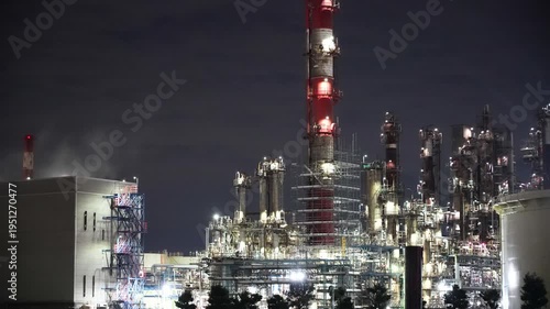 Night view of  industrial complex with glowing refineries