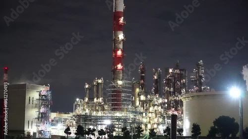 Night view of  industrial complex with glowing refineries