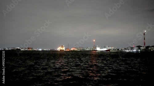 Night view of  industrial complex with glowing refineries