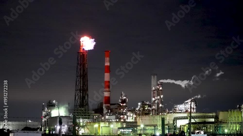 Night view of  industrial complex with glowing refineries