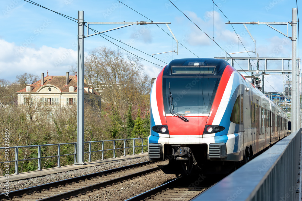 Fototapeta premium Modern electric train on railway tracks