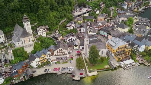 Stunning Aerial view of Hallstatt village and historic church on Lake Hallstatt, Austria. the iconic 19th-century Evangelical Church of Hallstatt and a UNESCO heritage point.
