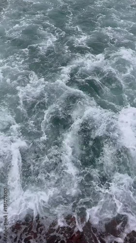 Wallpaper Mural Mesmerizing slow motion top view of powerful ocean waves crashing and churning. Beautiful dynamic white sea foam and splashing water creating an abstract marine nature background. Torontodigital.ca