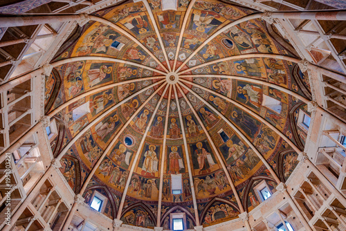Interior view of the magnificent octagonal dome of the Parma Baptistery featuring medieval frescoes and religious iconography in Parma, Italy 06.01.2026