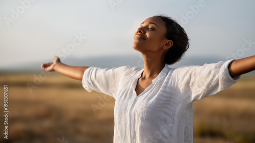 Faceless Black woman standing in an open field with arms wide open, head tilted upward, soft natural landscape behind, freedom and happiness, mental health outdoors, joy concept, breathing fresh