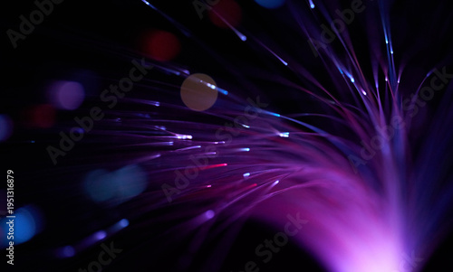 Glowing magenta optic fiber illustrating futuristic digital connection