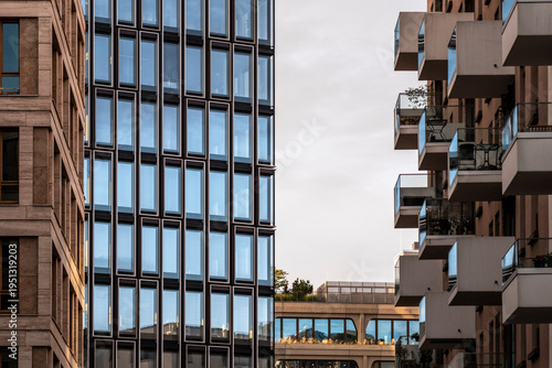 Urban city living in Berlin Germany shown by modern architecture building facade where repeating windows and balconies create rhythm and depth