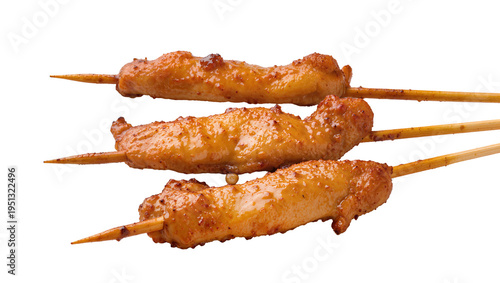 Photos Isolated three delicious grilled chicken wings on wooden skewers, savory and cri