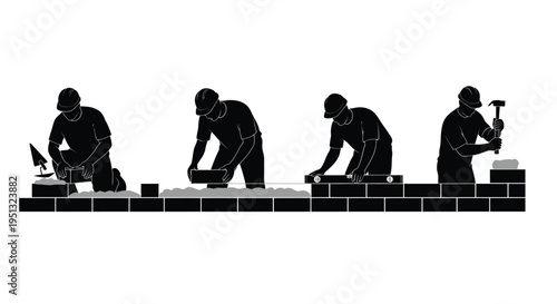 Construction workers building a brick wall in a striking silhouette