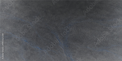 A textured canvas of charcoal gray with subtle shades, offers a versatile backdrop for design and artistic projects. The rough texture creates visual interest and depth. 